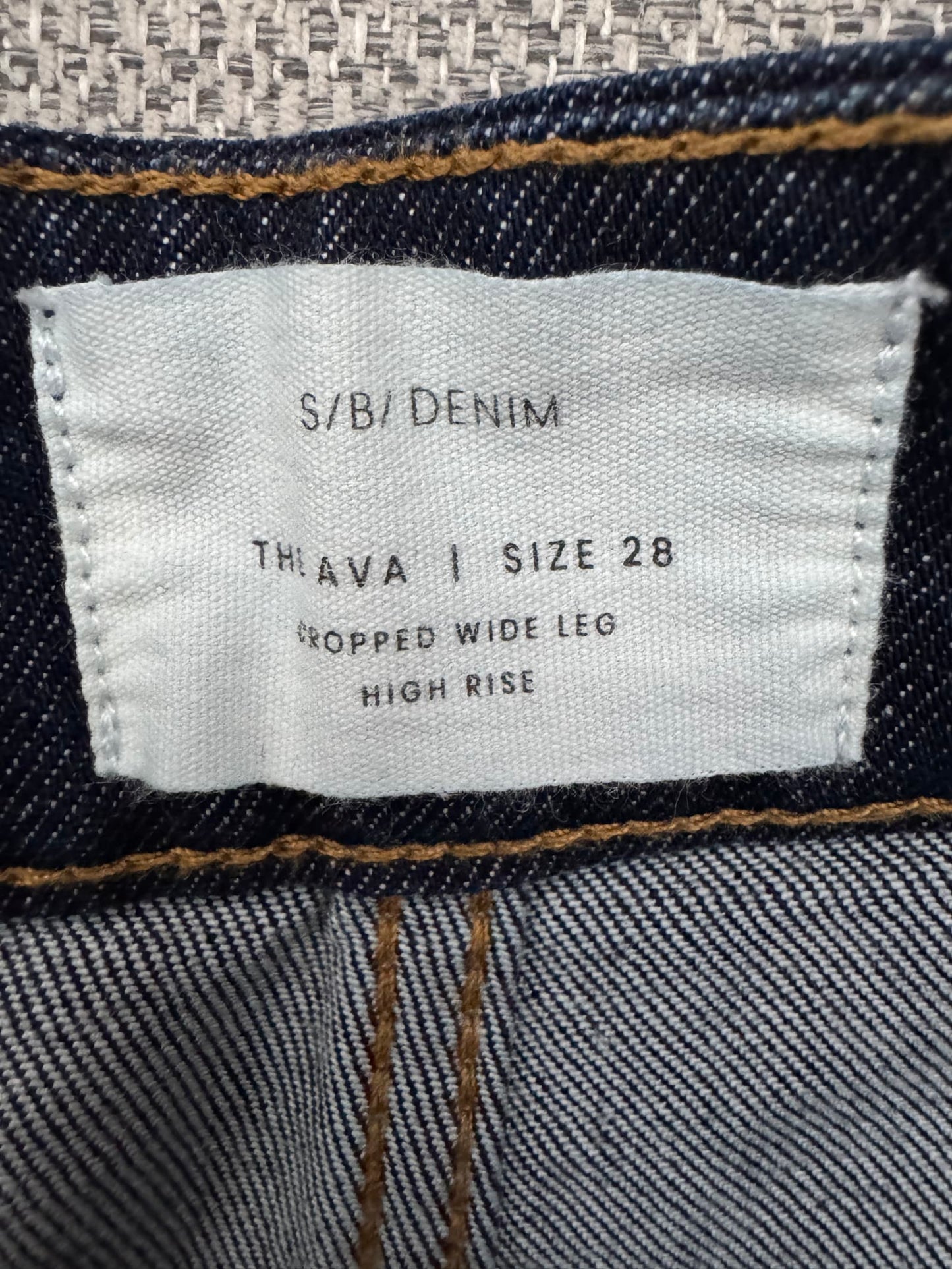 75697
