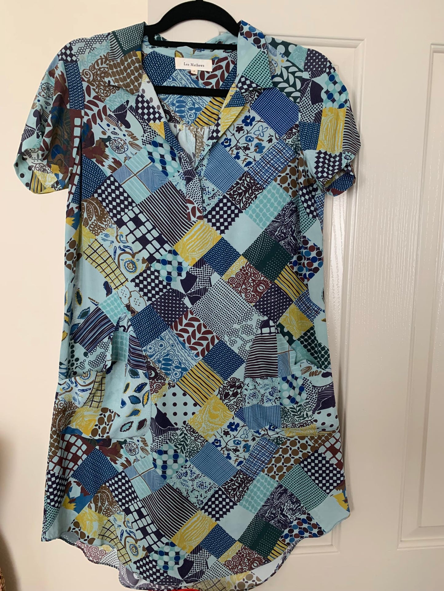 100577
